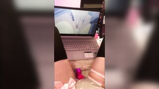 girl uses toy while watching hentai