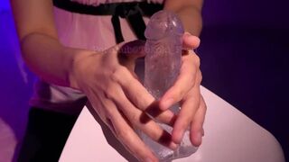 Woman giving erotic handjob on dildo with lotion - 1 image